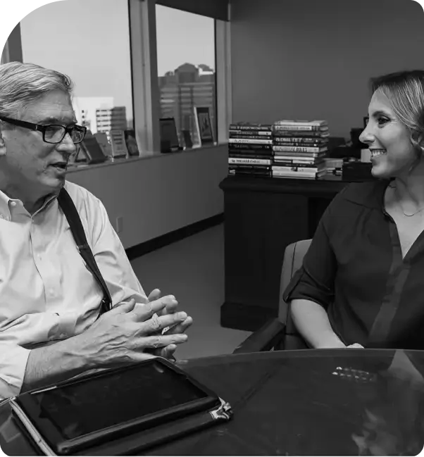 Doug Conant in conversation, behind a desk